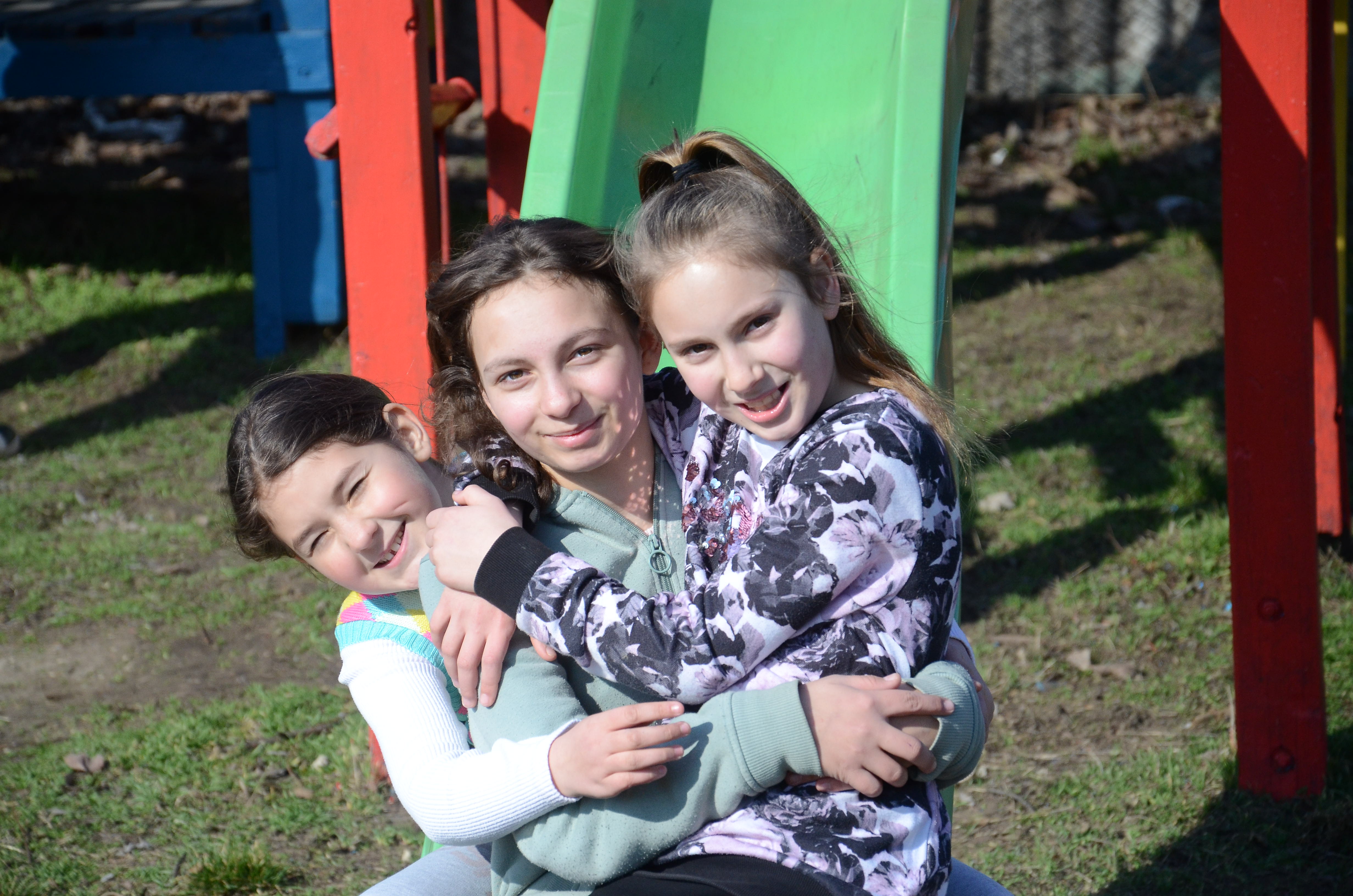 Claudia playing outside with friends