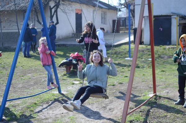 Claudia playing on the swings at after school