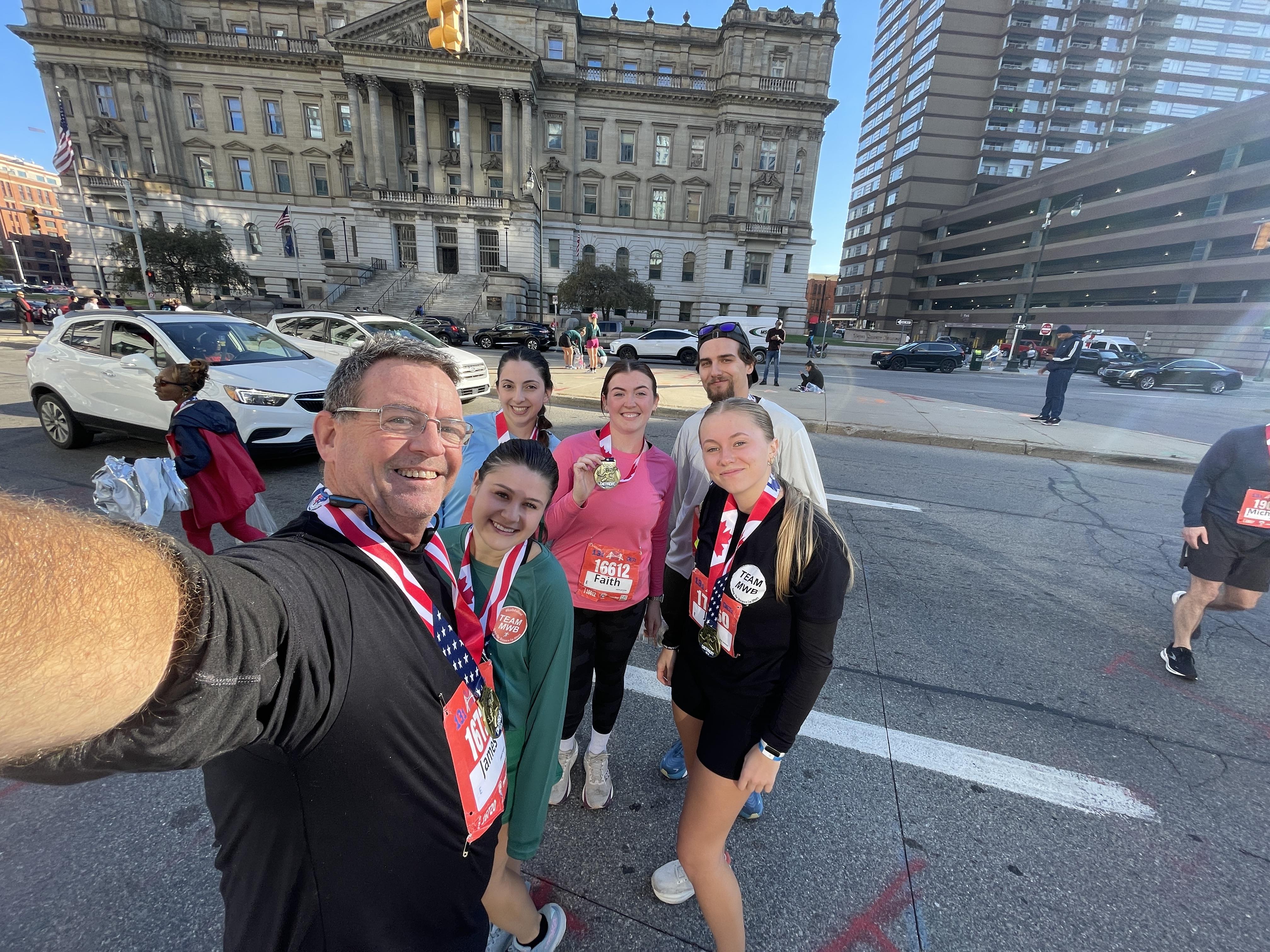 Team MWB Runners toeing the line at the Detroit International Half-Marathon